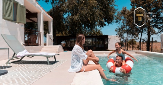 family having fun at a pool